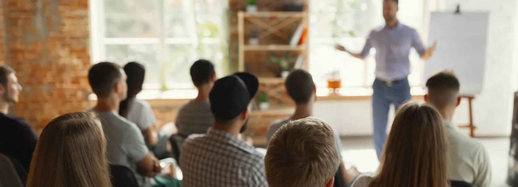 A man leading a corporate training session