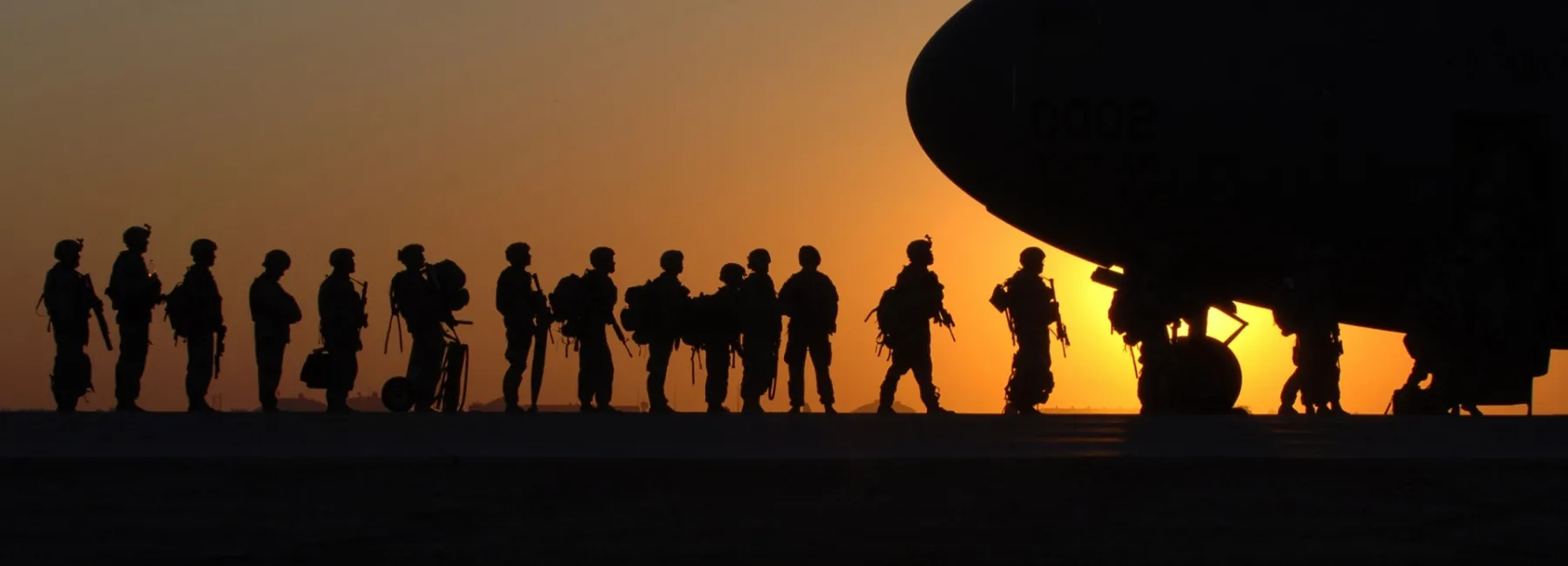 Soldiers boarding a plane