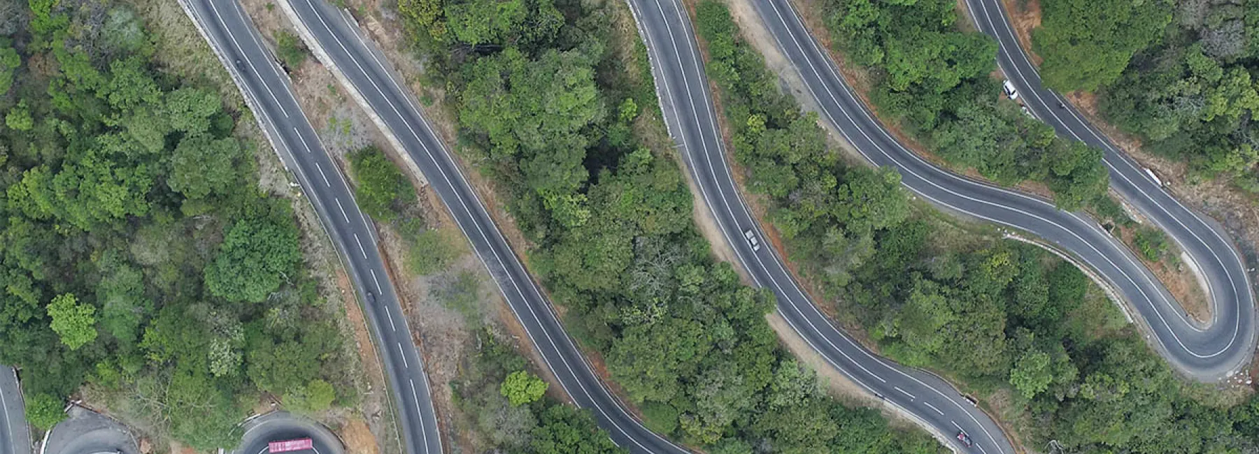 aerial shot of roads winding up a hill