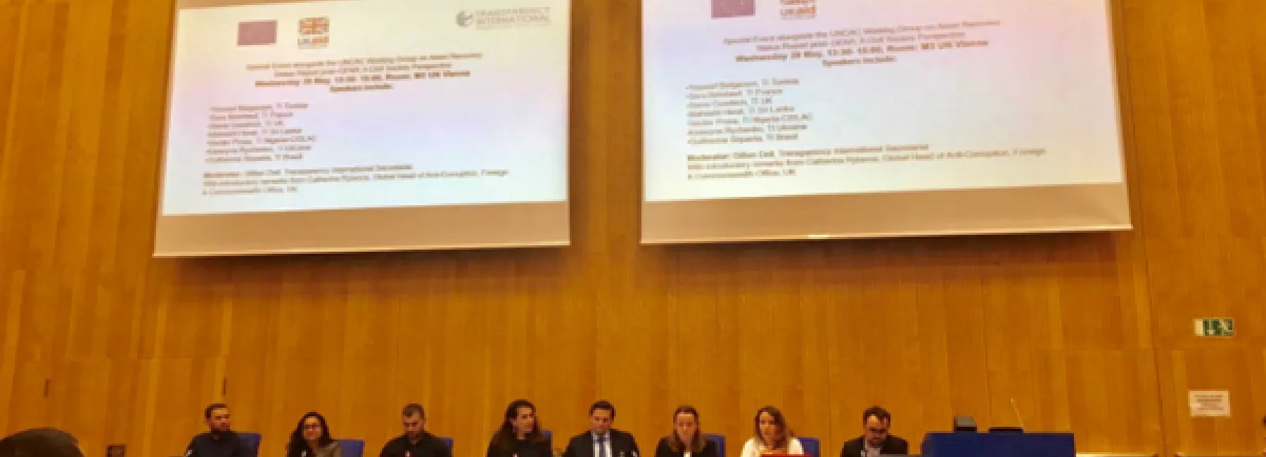 People speaking at a conference