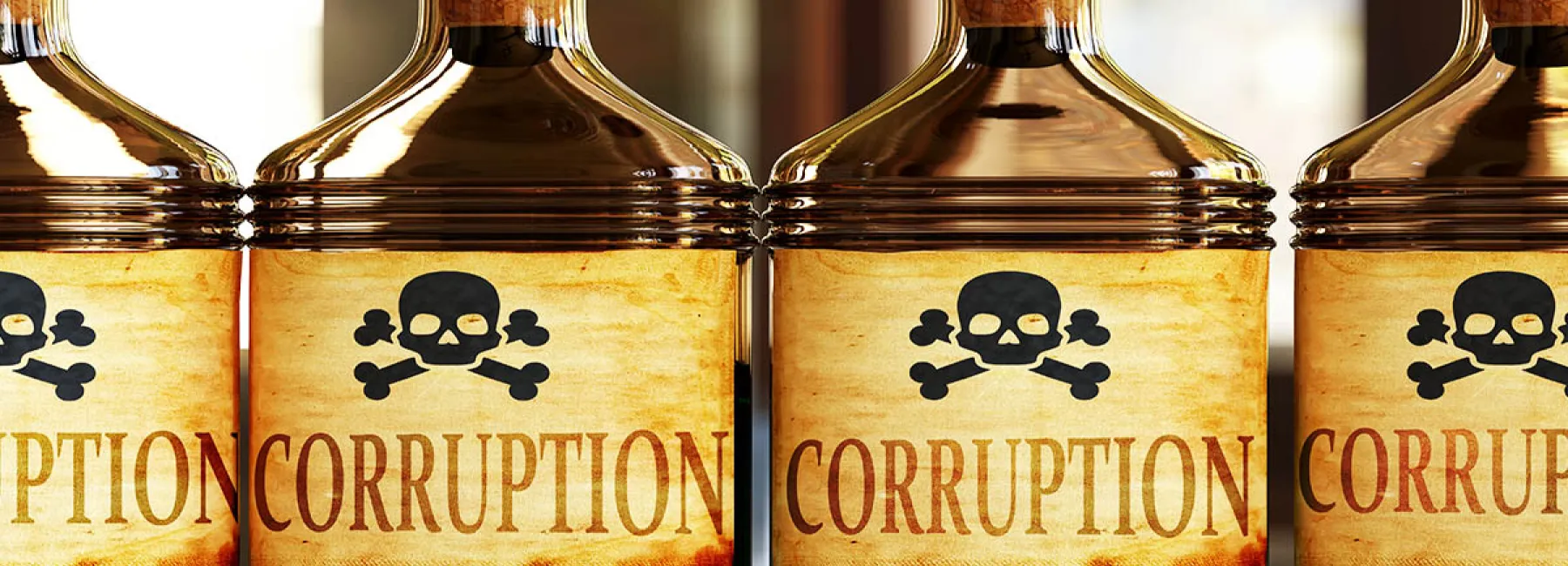 Poison bottles with 'corruption' written on