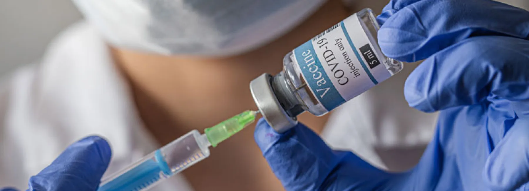 Doctor with COVID vaccine