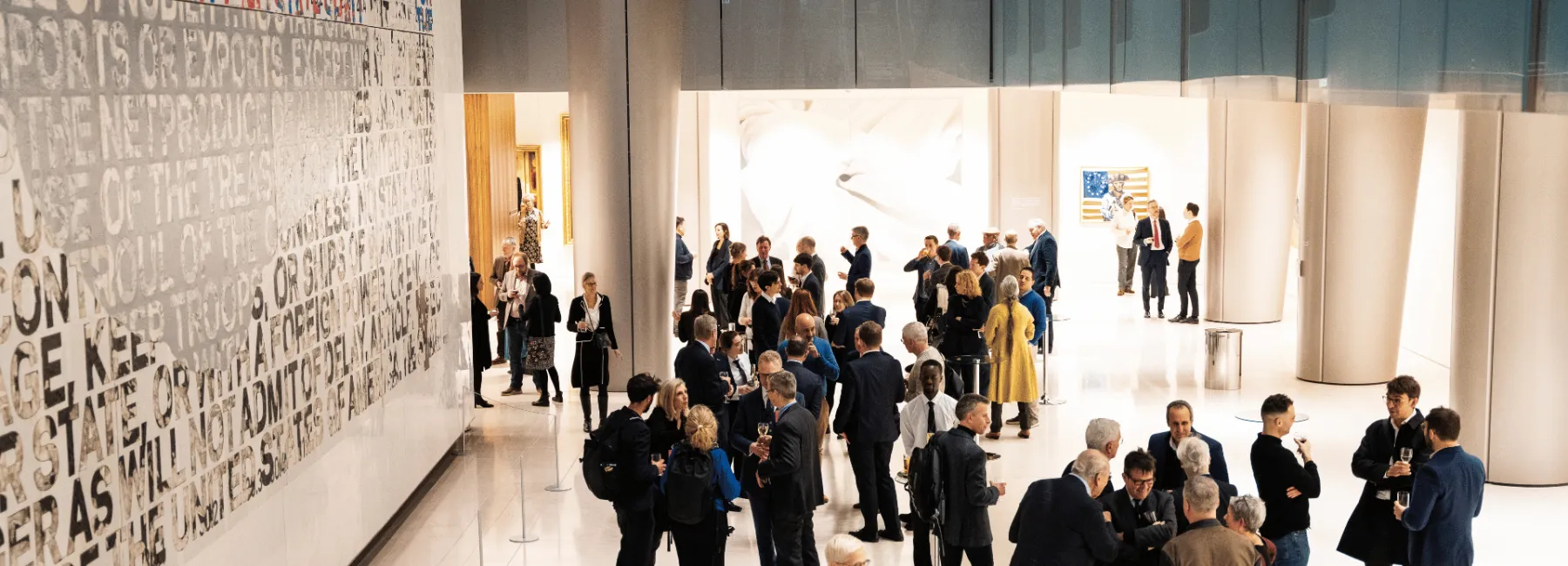 People talking at an event reception