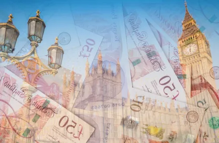 Pound notes in front of the Palace of Westminster