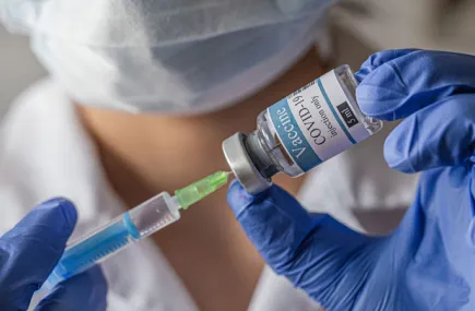 Doctor with COVID vaccine